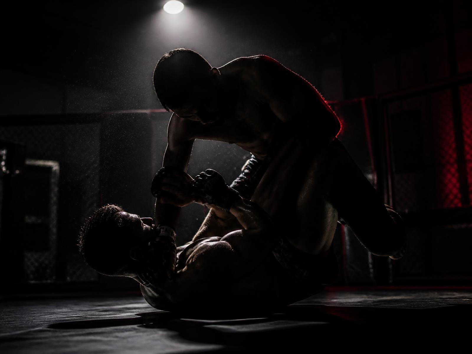 Two fighters training on the mats at Shackelford's MMA Center
